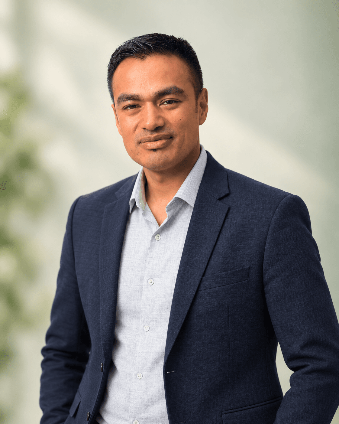 Bhupendra Shrestha wearing a navy blazer in a professional portrait